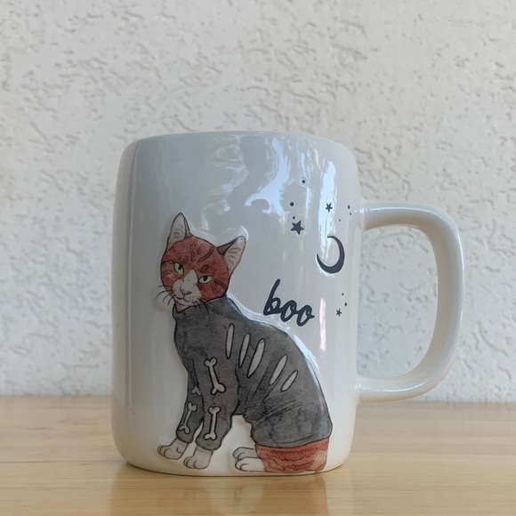 Rae Dunn Halloween Cat Mug wearing a Skeleton sweater. Boo - Picture 1 of 9